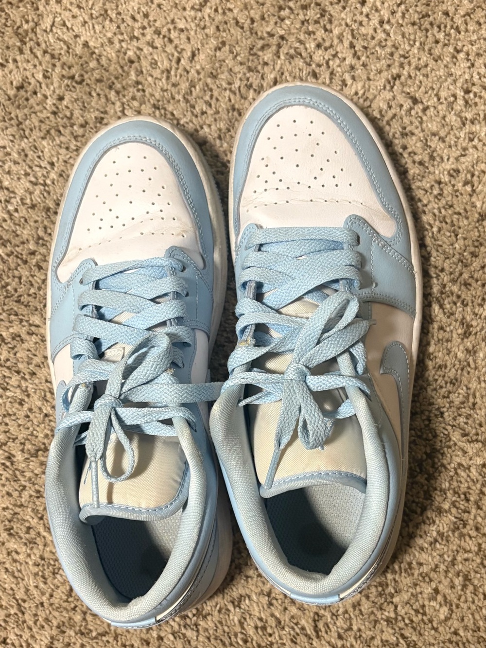 Nike women’s Light Blue and White Jordan low top shoes.
